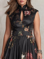 Detail shot of the mock neck keyhole collar, cap sleeves and rose print satin fabric at the bodice