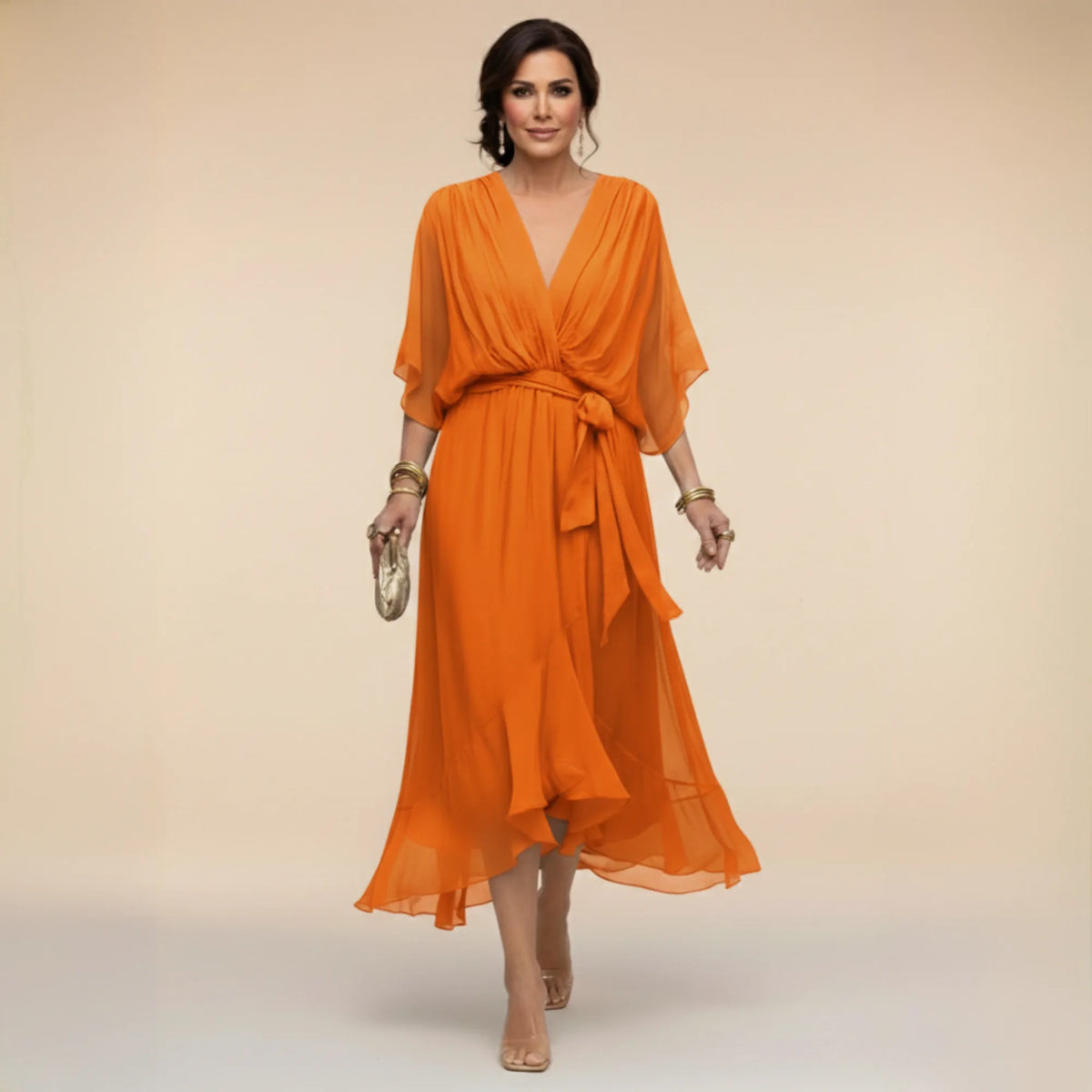 Full-length view of the flowing chiffon midi dress capturing the asymmetric handkerchief hemline
