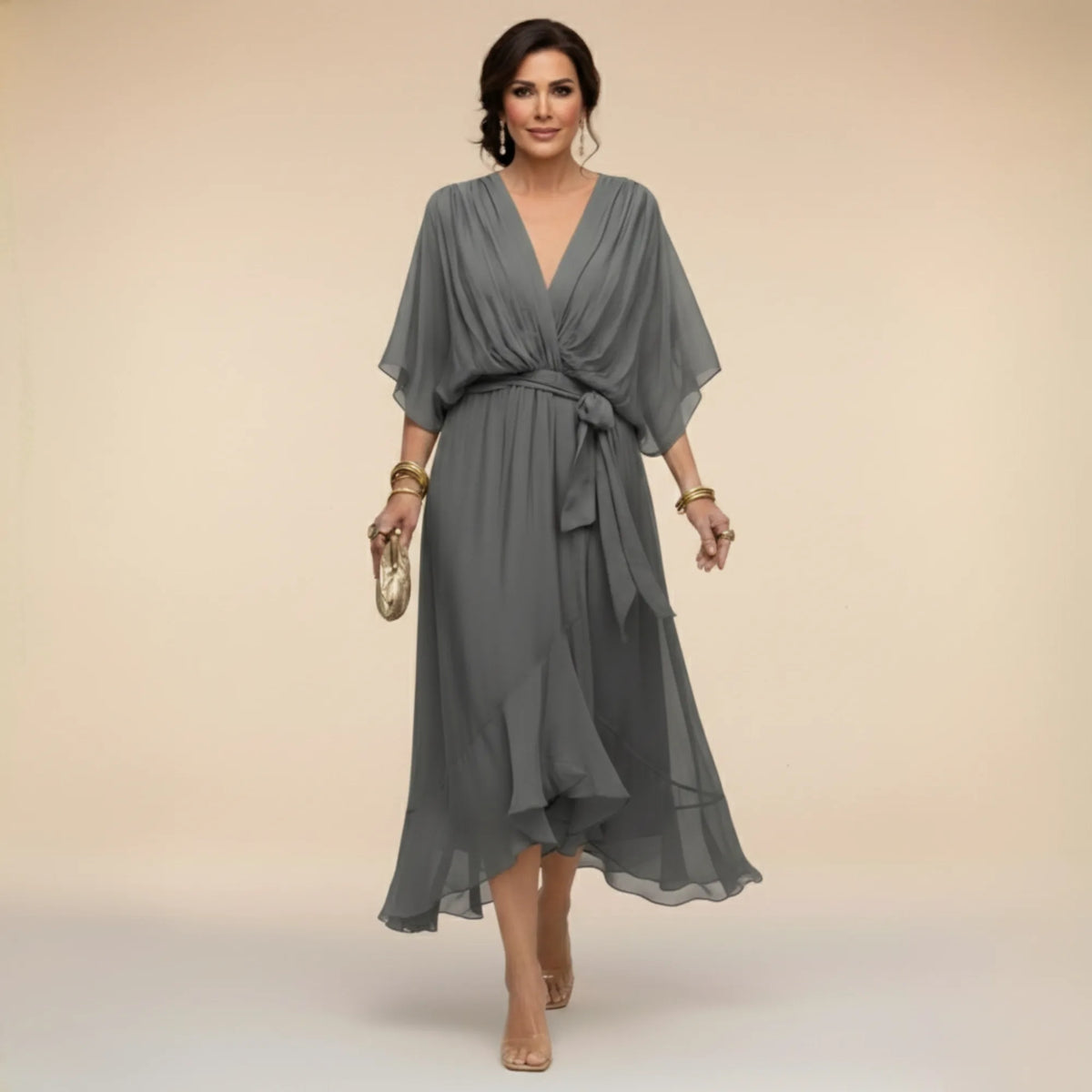 Grey chiffon midi dress showing the soft drape of the sleeves and the waist-defining belt