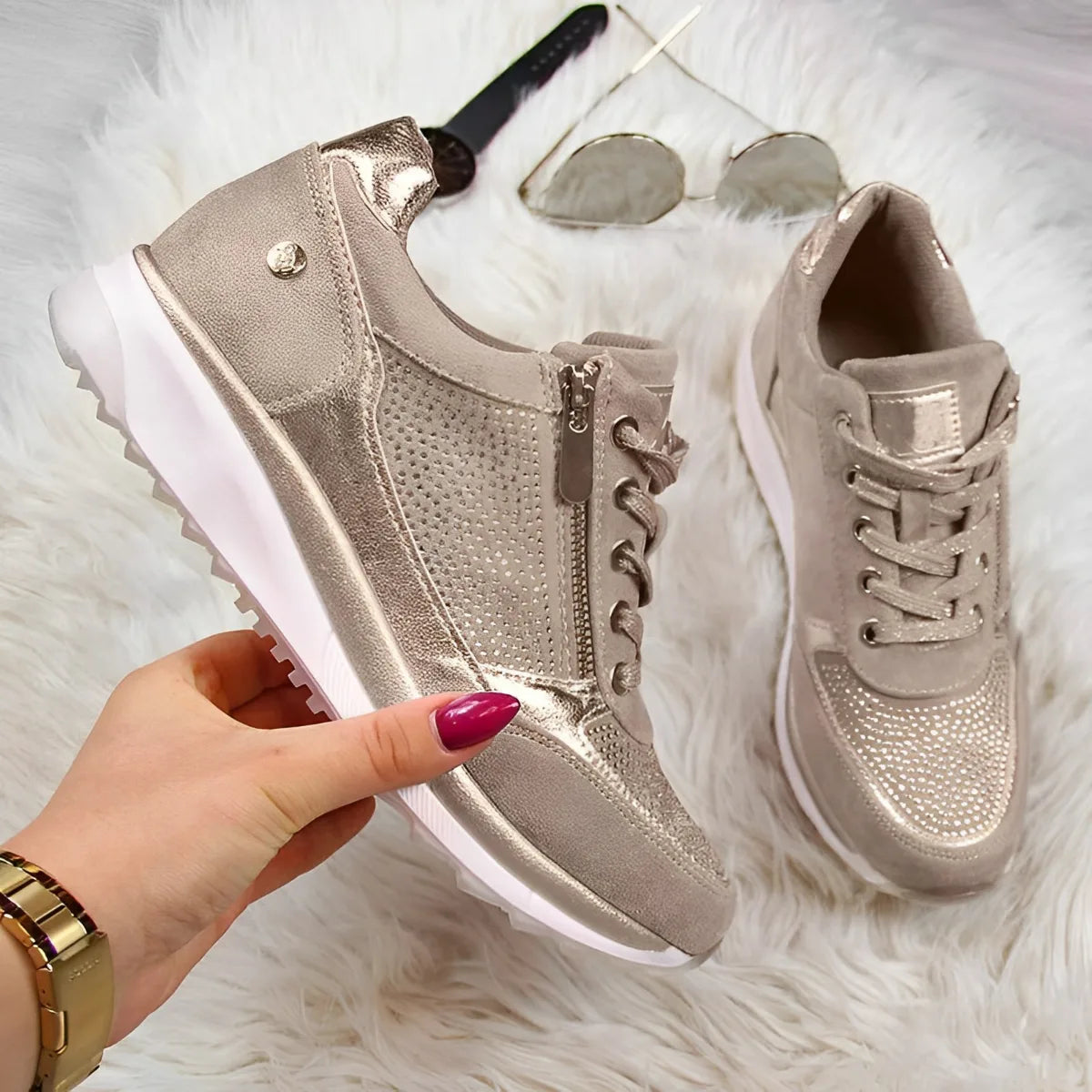 Angled view of grey metallic sneakers with one shoe tipped to show the chunky white outsole tread