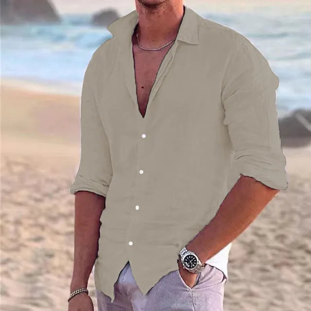 Khaki beige linen shirt with button-down collar worn casually open, paired with light grey trousers