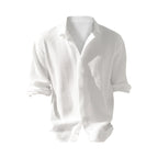 Crinkled white cotton gauze shirt with soft collar, button front and relaxed drape, shown front-on