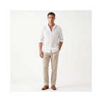 Full-length look paired with beige linen trousers and brown leather loafers for a smart-casual outfit