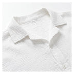 Close-up of the soft collar and button placket, highlighting the textured crinkled cotton weave