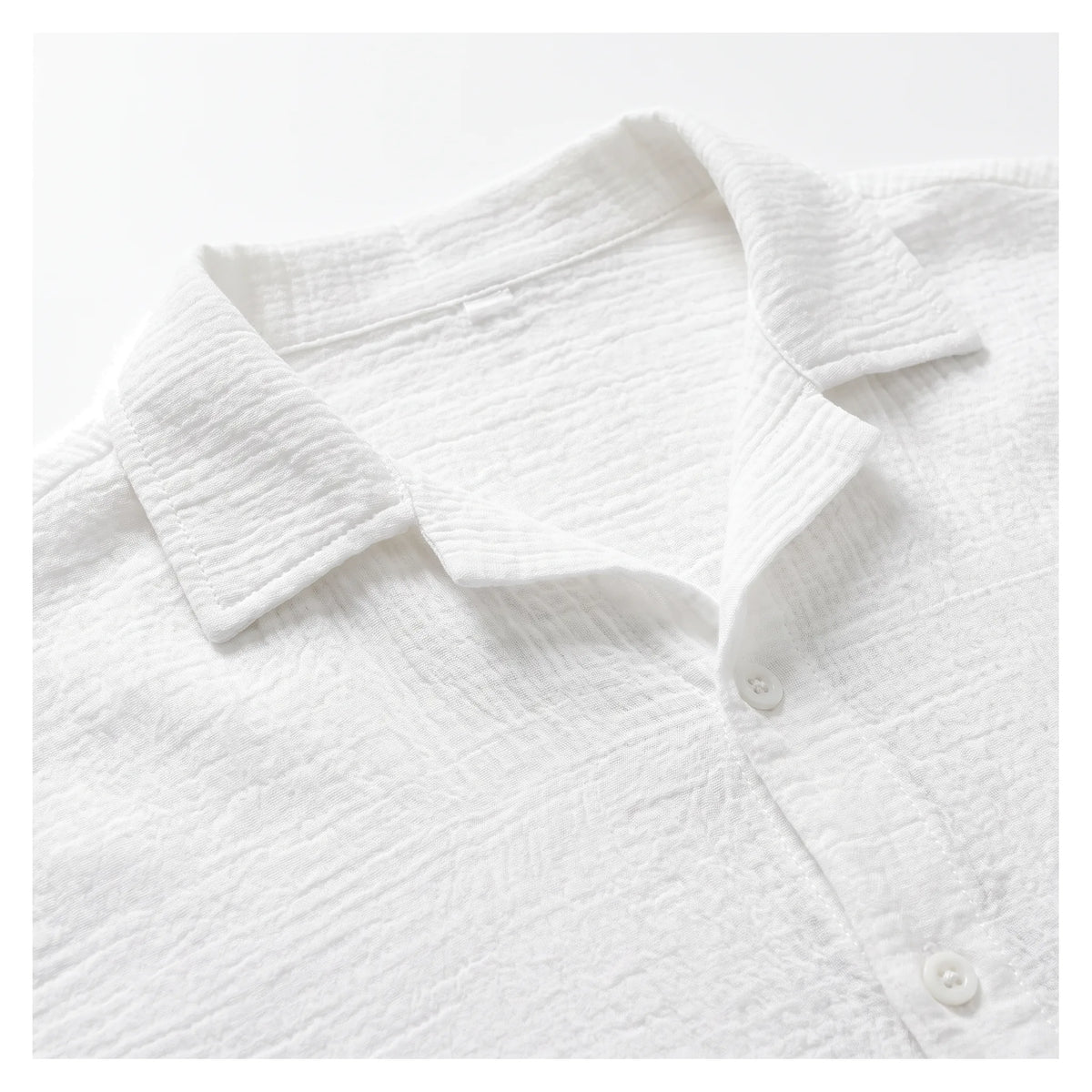Close-up of the soft collar and button placket, highlighting the textured crinkled cotton weave