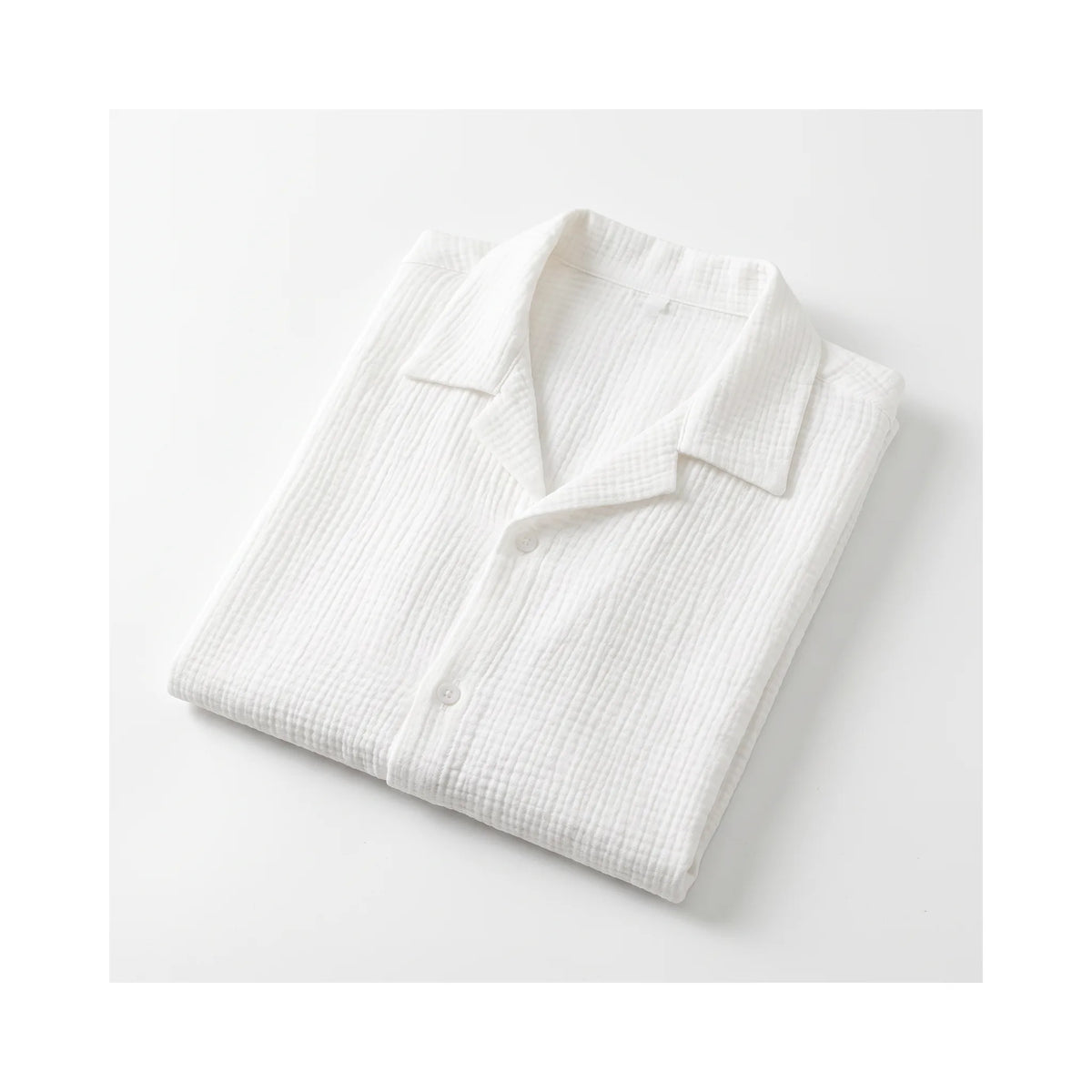 Shirt folded flat, showing the all-over crinkle texture and natural drape of the fabric