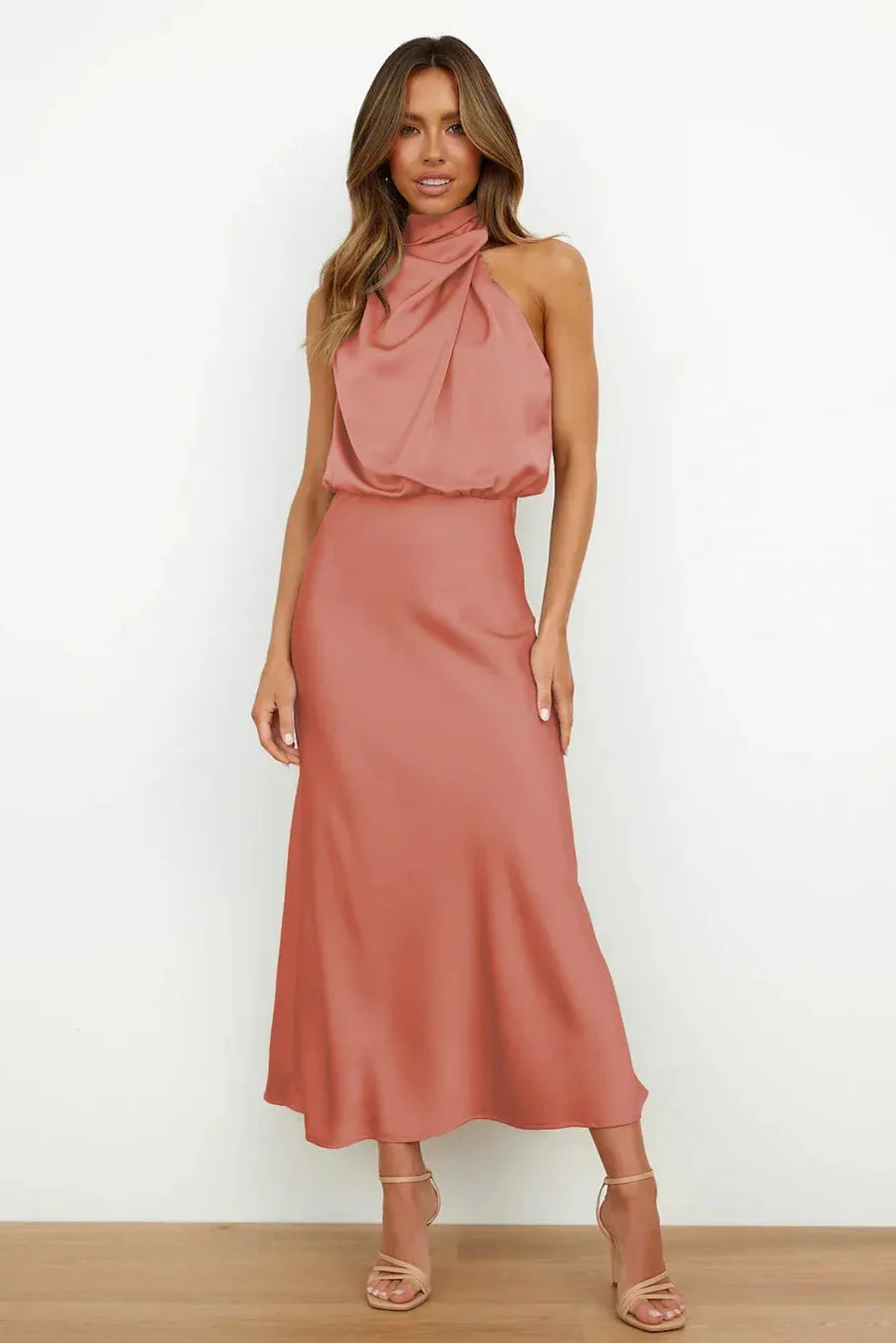 Full-length front view of terracotta satin dress with blouson bodice and draped high neck