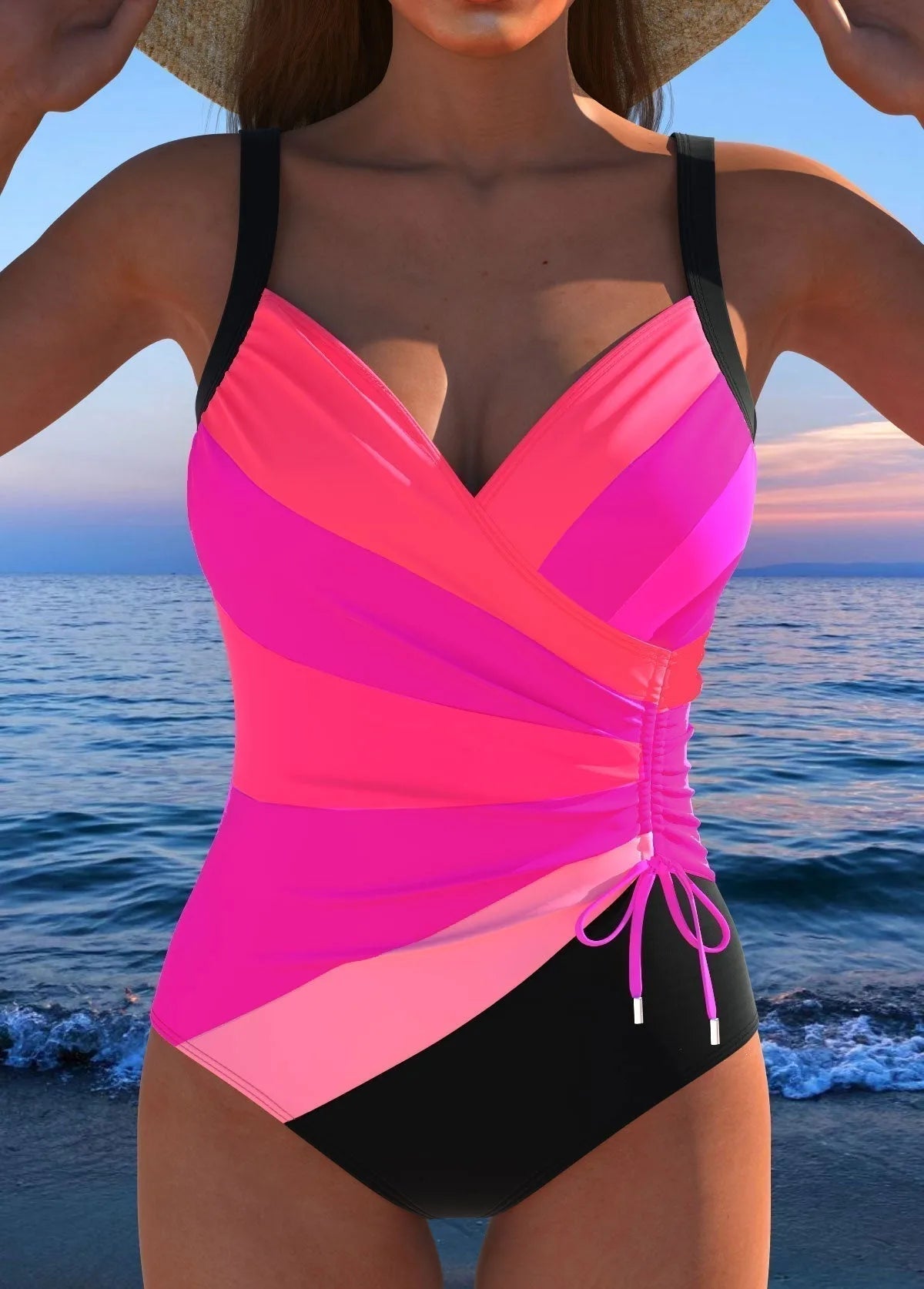 Front view of a pink and black colour-block one-piece swimsuit with wrap bust and ruched waist
