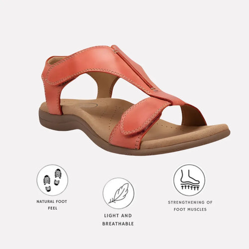 Orange leather T-strap sandal with adjustable straps and tan padded sole, shown from the side