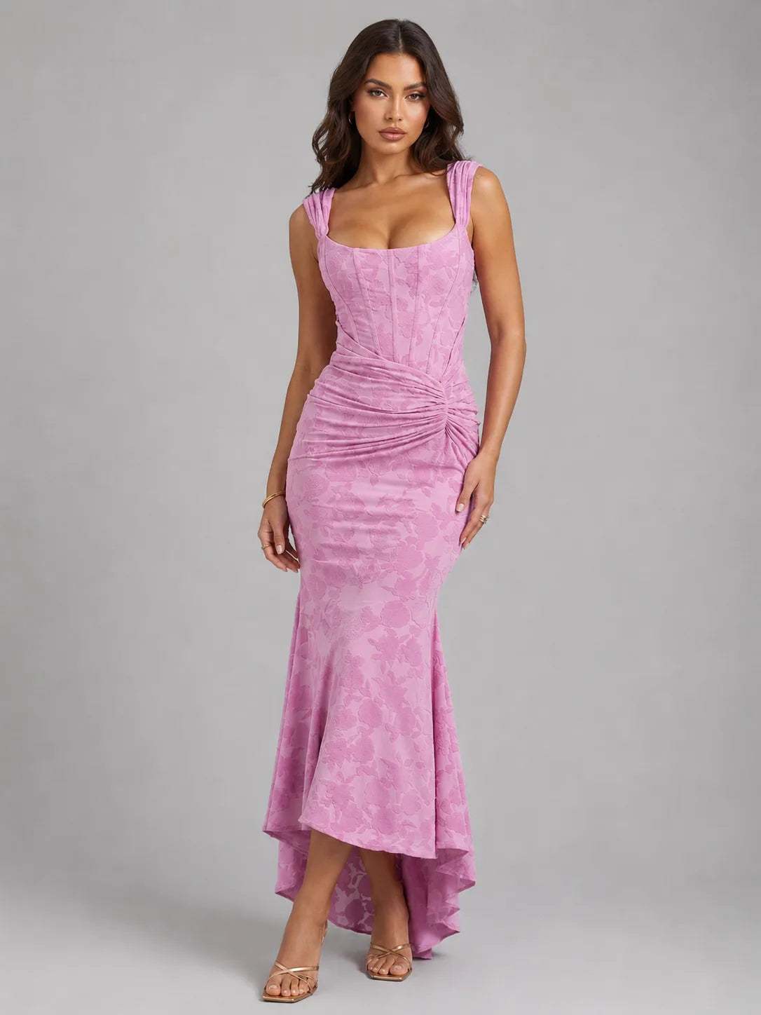 Front view of a pink floral jacquard corset maxi dress with sweetheart neckline and high-low fishtail hem