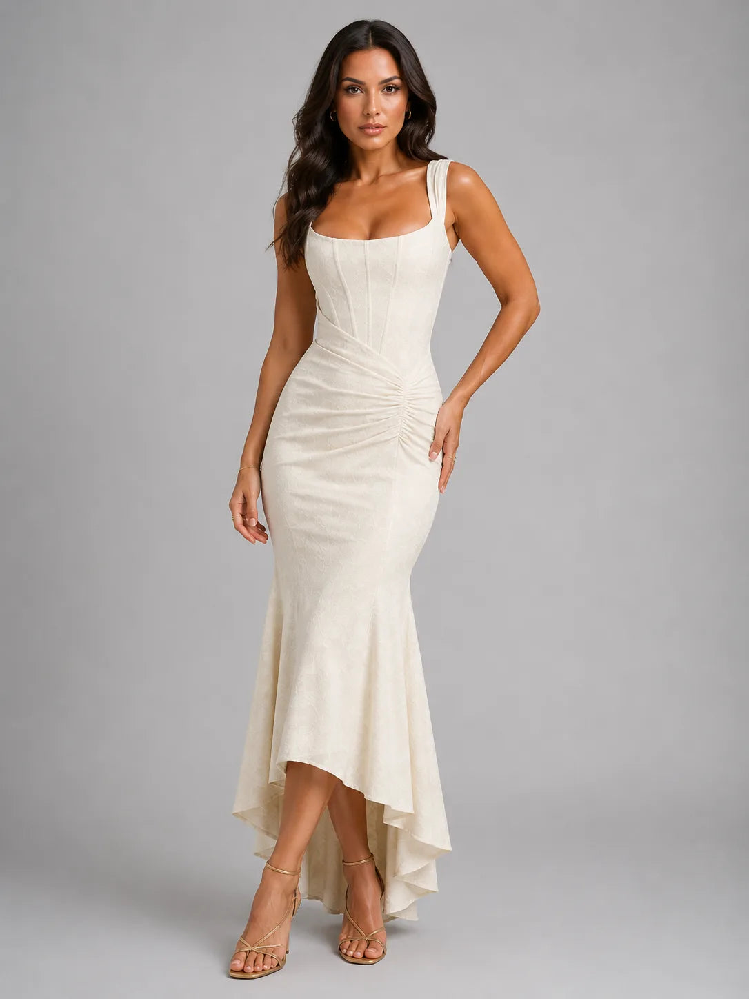 Front view of the same corset maxi dress in a cream colourway with high-low fishtail hem