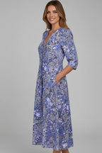 Side profile of the blue floral midi dress showing the flared skirt and relaxed fit