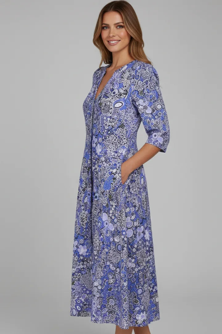 Side profile of the blue floral midi dress showing the flared skirt and relaxed fit