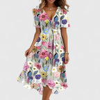 Close-up of white floral print chiffon midi dress with V-neck and short flutter sleeves on model