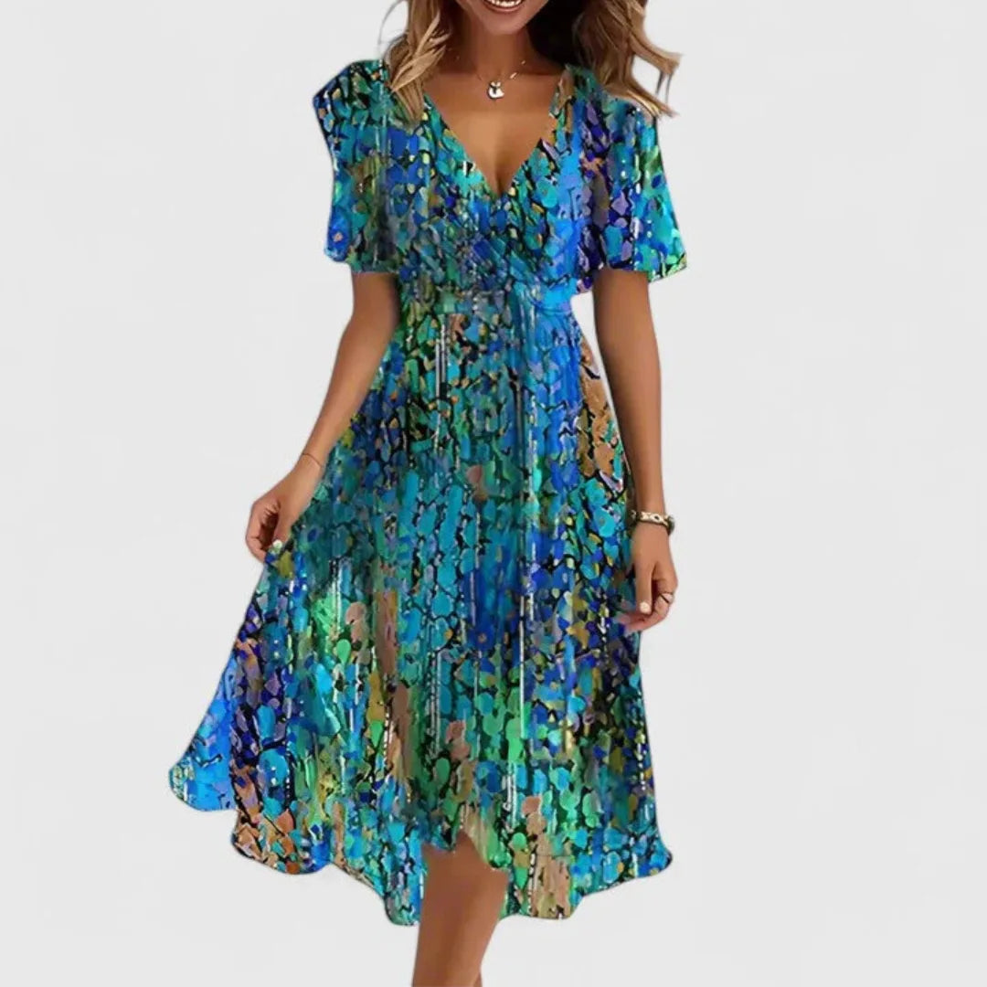 Blue green abstract print chiffon midi dress shown with V-neckline and flowing flutter sleeves