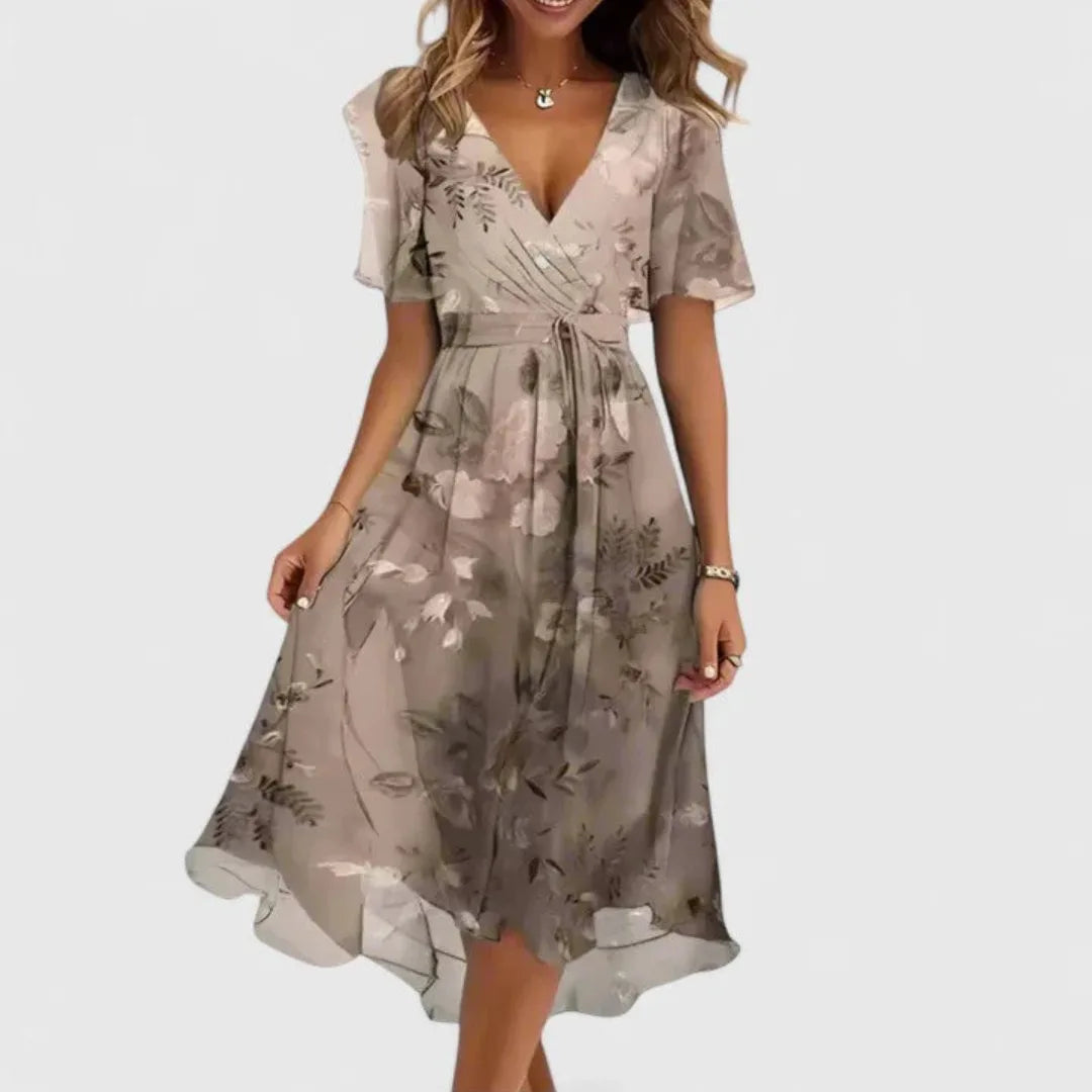 Beige floral chiffon midi dress with soft botanical print, V-neckline and short sleeves on model