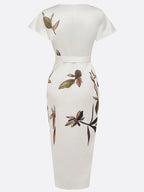 Flat lay product shot of the ivory wrap midi dress showing full front silhouette, tie waist and tulip hem