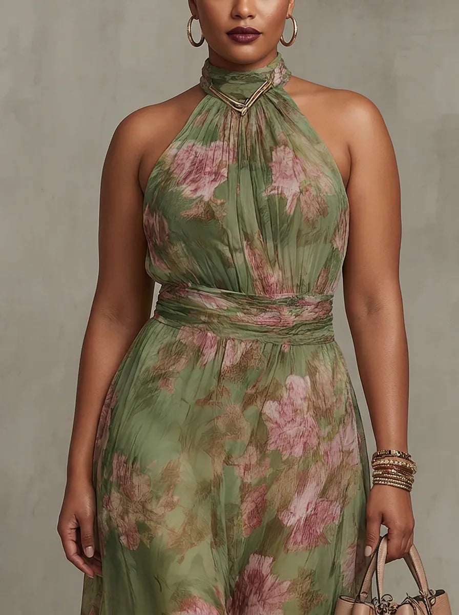 Close-up of the halter neckline with gold hardware clasp, ruched bodice and tonal green and pink floral print