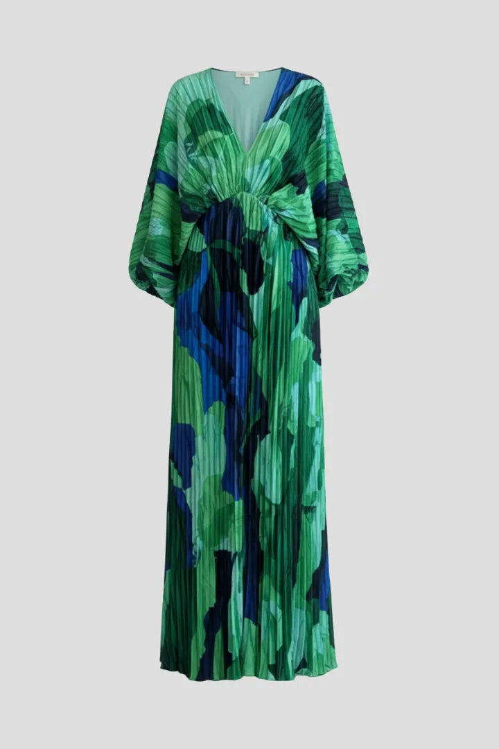 Flat product shot of the pleated green and blue print maxi dress showing its full length and side slit