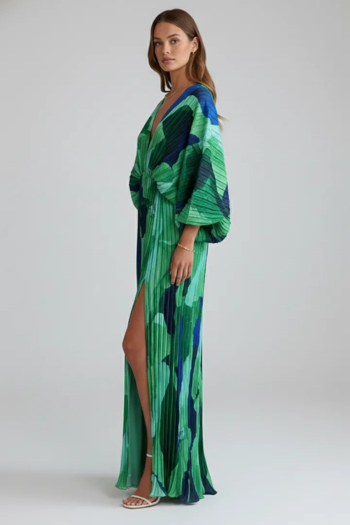 Side profile of the model highlighting the thigh-high side slit and billowing sleeve shape of the dress