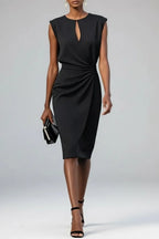 Black midi dress with cap sleeve shoulders, keyhole neckline and draped gathered waist, accessorised with a black clutch