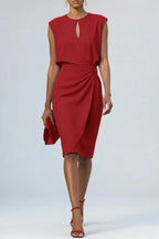 Deep red midi dress with keyhole neckline, soft cap sleeves and draped waist gathering, styled with red strappy heels