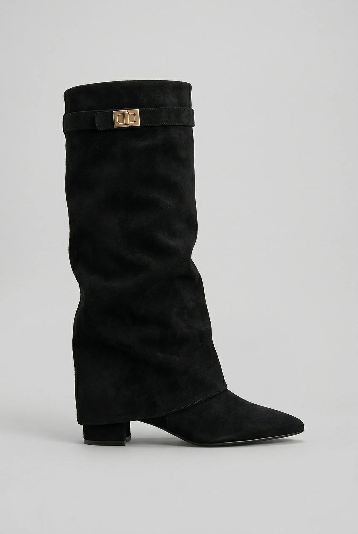 Side profile of a black suede-look knee-high boot with slouchy shaft, pointed toe and gold turn-lock buckle strap