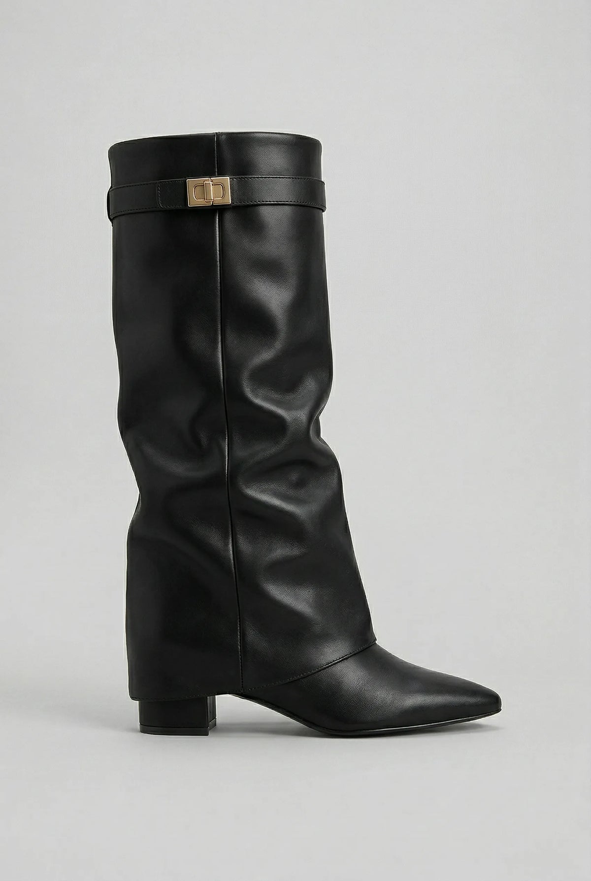 Side view of a black leather-look knee-high boot with block heel, pointed toe and gold buckle detail at the cuff
