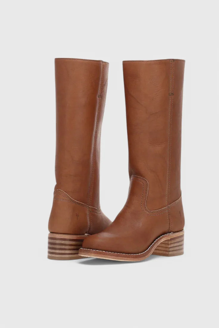 Front and side view of knee-high tan leather boots with stacked wooden block heel and round toe