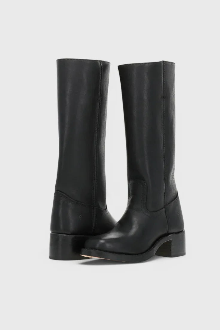 Front view of black knee-high leather boots with stacked block heel standing against a plain background
