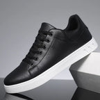 Side profile of black leather sneaker with black laces, black lining and contrasting white sole