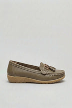 Side profile of a taupe leather loafer with gold-tone hardware and stitched apron toe