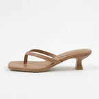 Mocha tan leather thong sandal shown from the side, highlighting its slender straps and kitten heel