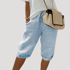 Light blue linen bermuda shorts with cuffed knee length hem and soft elastic waistband