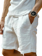 Front view of white linen-blend shorts with drawstring waistband paired with a relaxed white linen top