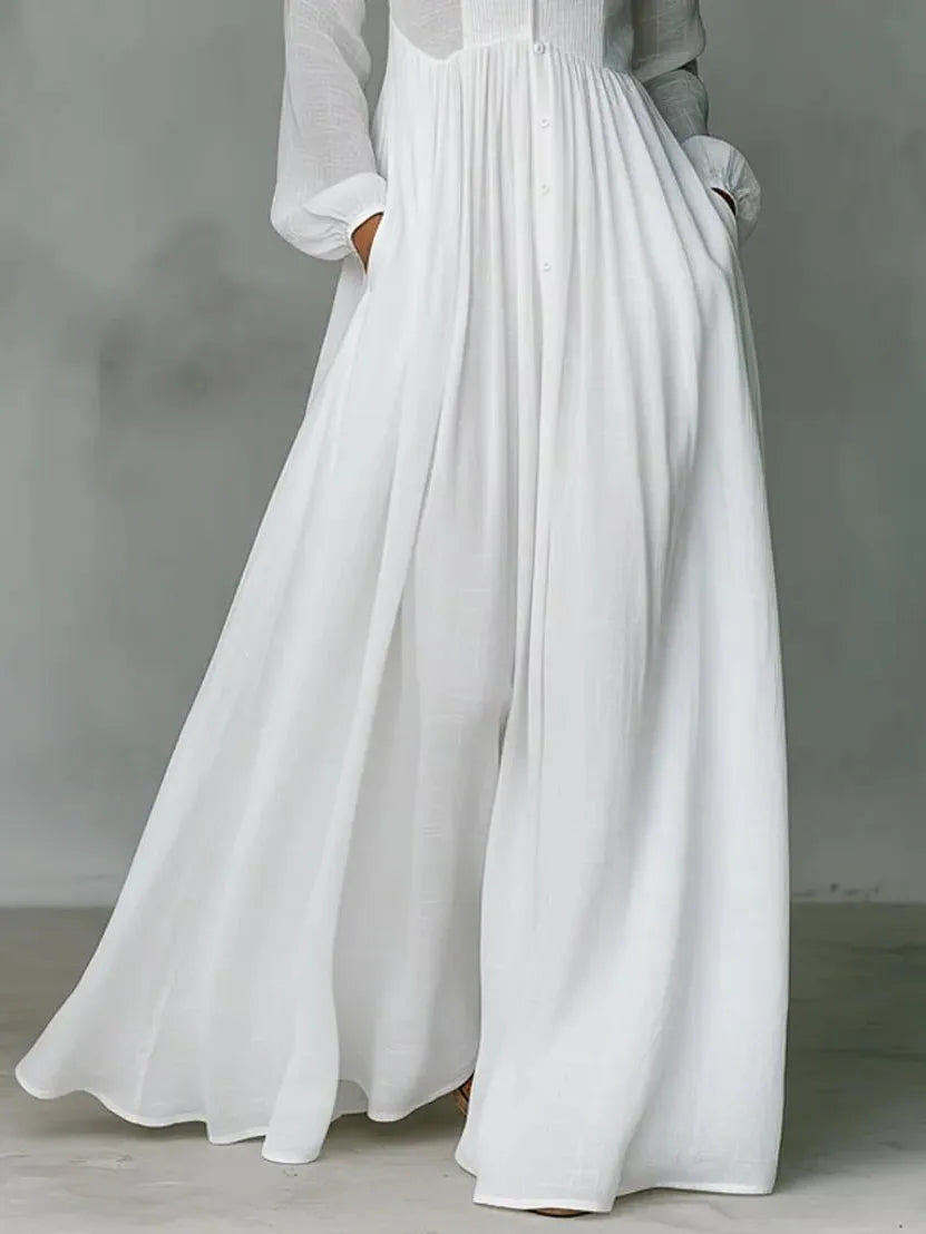 Close-up of the gathered waist and flowing skirt panel showing the fabric texture and hidden side pocket