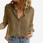 Front view of a brown linen button-up blouse with stand collar and open V neckline