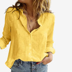 Front view of a bright yellow linen blouse with button placket and long sleeves