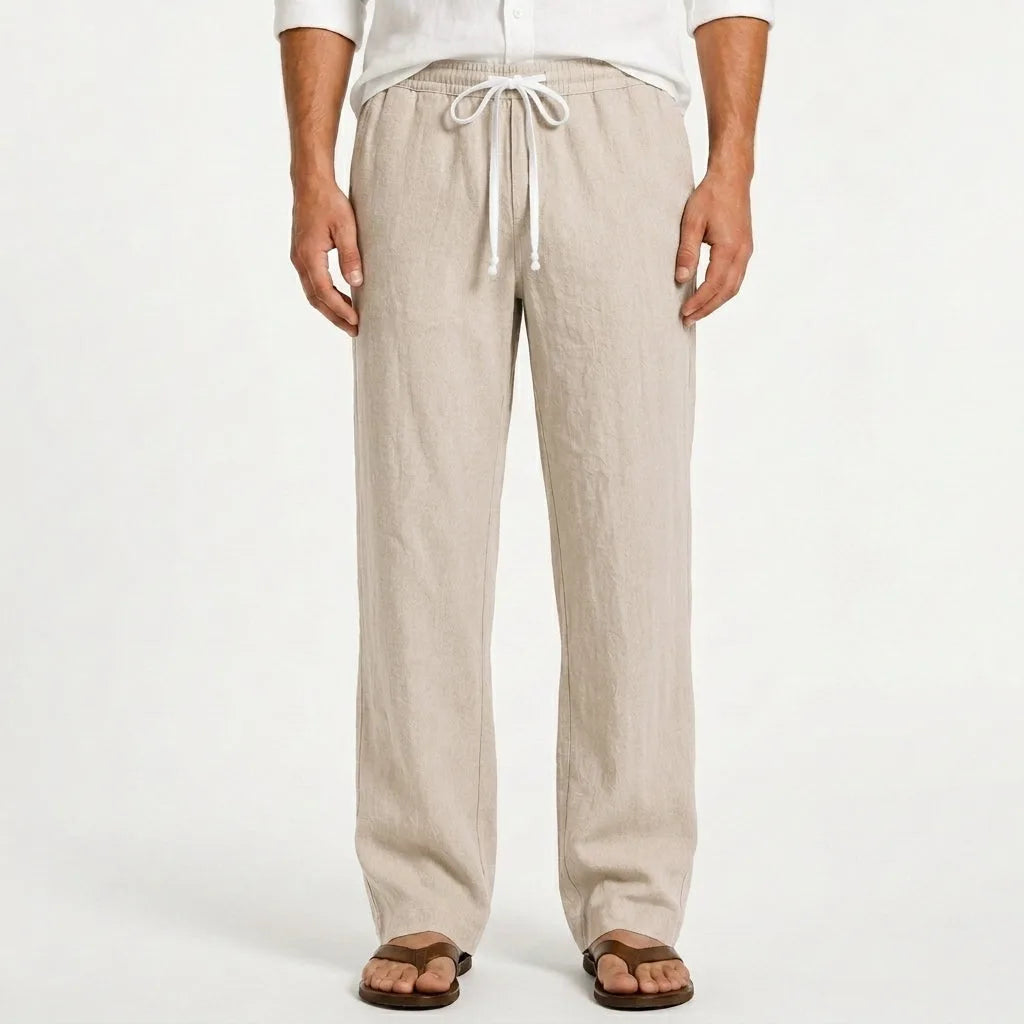 Man modelling sand beige linen trousers with elasticated drawstring waist and side pockets