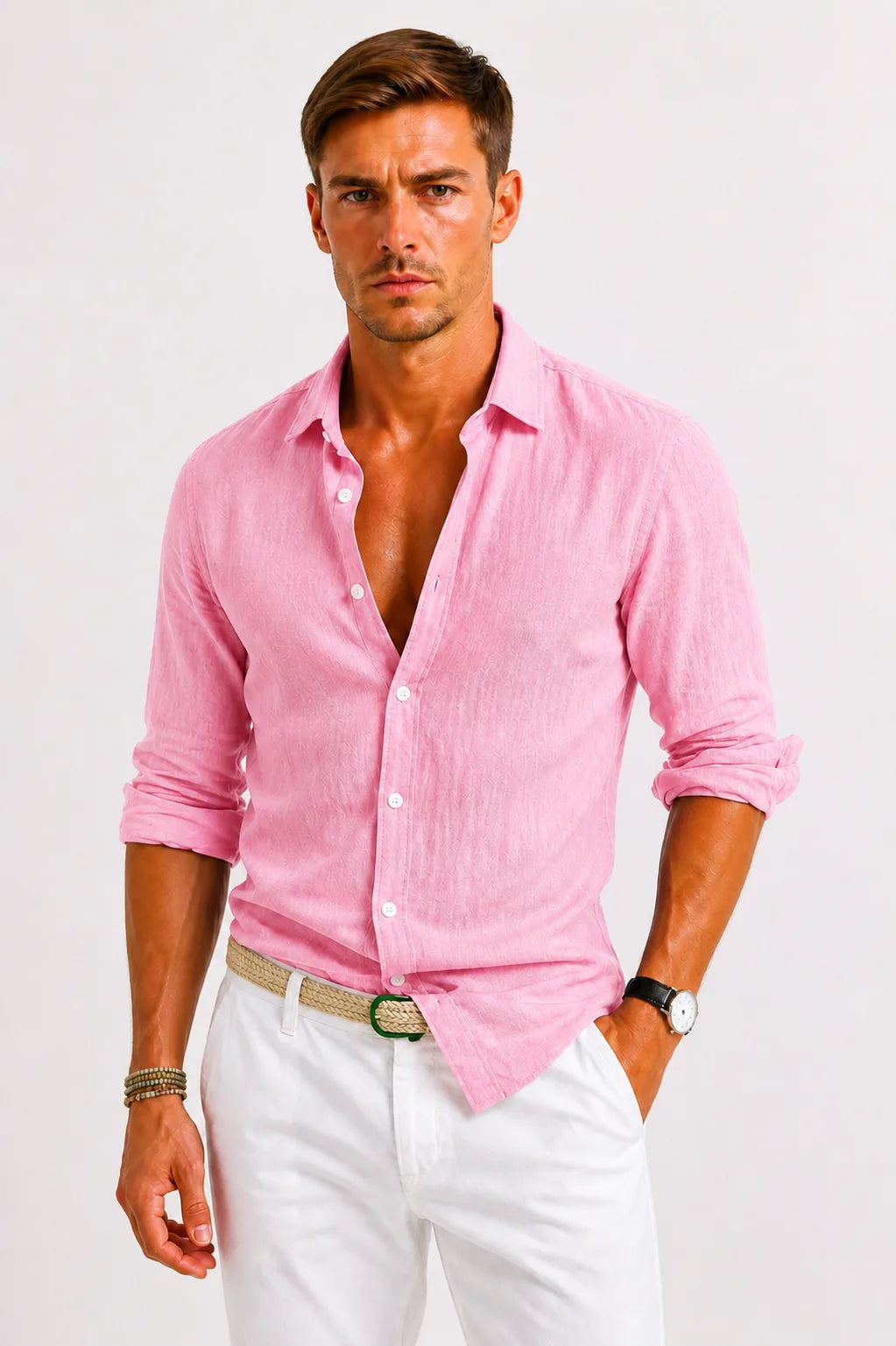 Pink linen shirt with textured weave, button front and classic collar, sleeves rolled, paired with white pants.