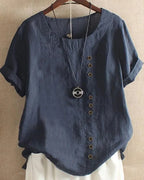 Navy blue linen blouse with round neckline and short rolled sleeves, buttons running down the left side of the chest