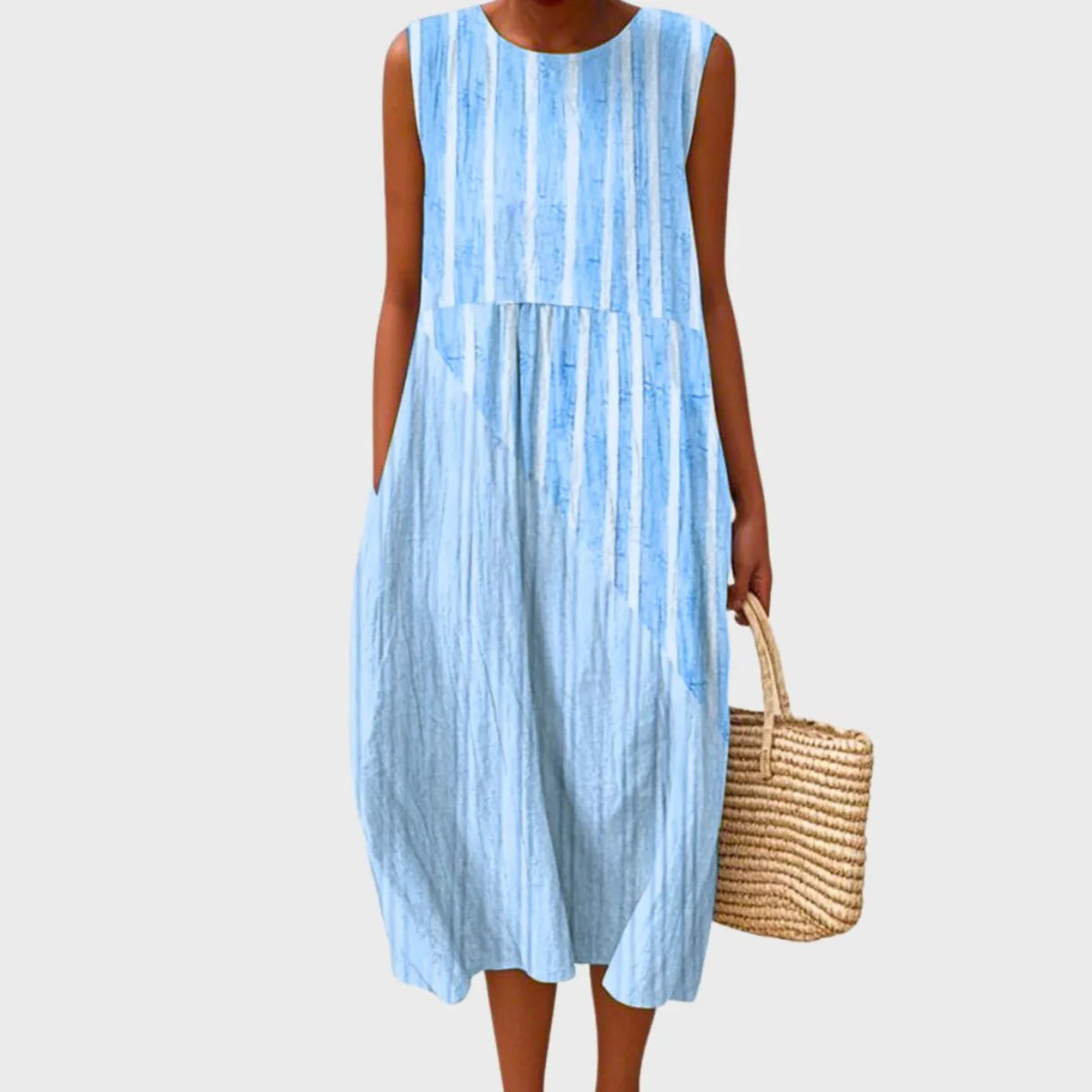 Sleeveless blue and white vertical striped midi dress with a tie-dye effect, relaxed tiered silhouette and round neckline
