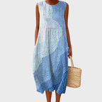 Sleeveless midi dress in a textured blue and white ombre pattern with a pebbled finish, loose flowing cut