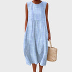 Sleeveless blue and white striped midi dress in a soft linen-look fabric, relaxed tiered shape with round neckline