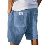 Light blue corduroy shorts with a back patch pocket, side seam pocket and drawstring waistband