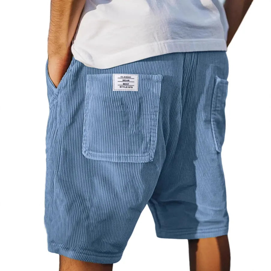 Light blue corduroy shorts with a back patch pocket, side seam pocket and drawstring waistband