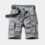 Grey cargo shorts laid flat, front view, with webbing belt, drawstring waist and side cargo pockets