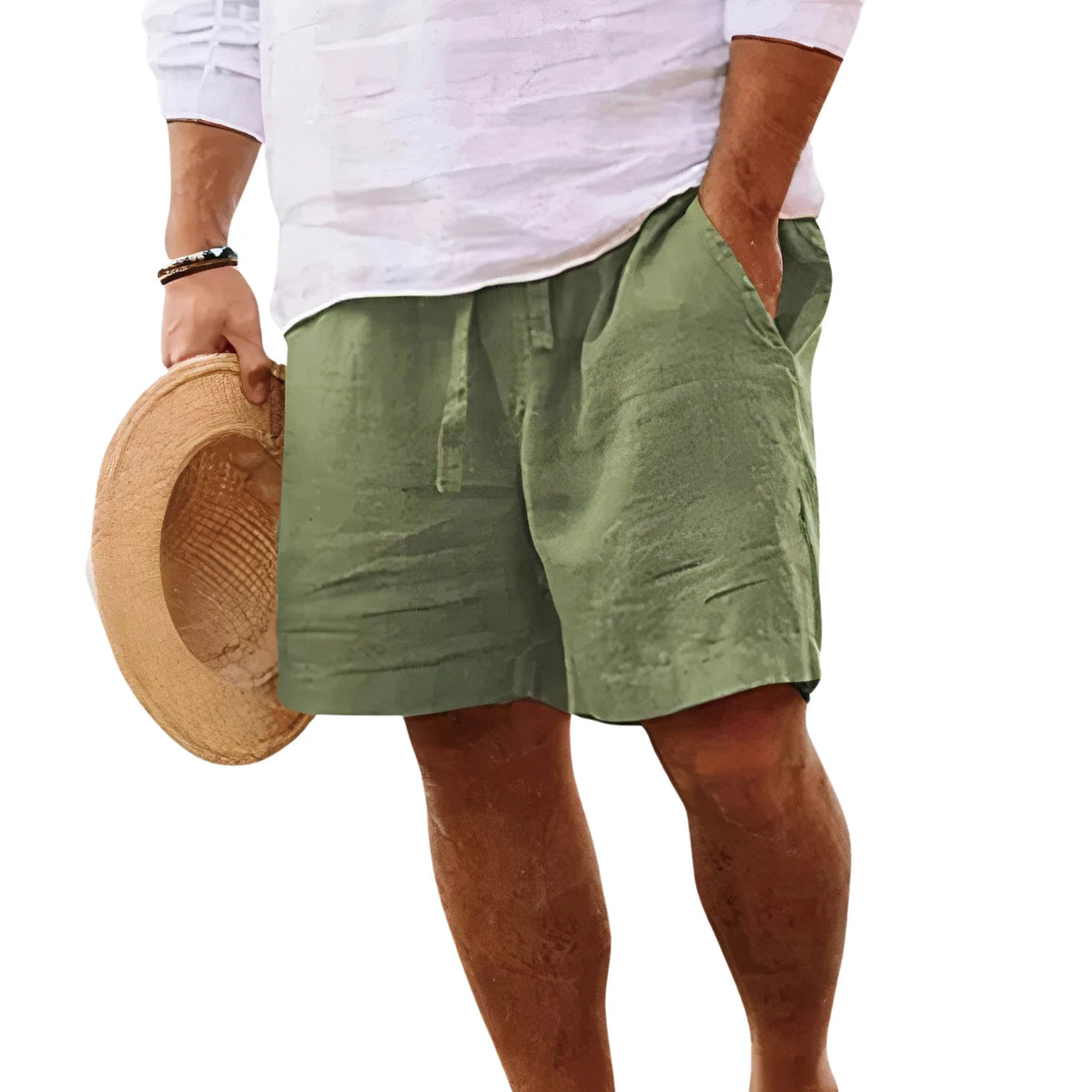 Side view of a man wearing khaki green drawstring shorts with hand in pocket, cropped below the waist