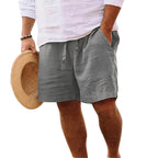 Close-up of the elastic waistband and drawstring cord detail on a pair of shorts