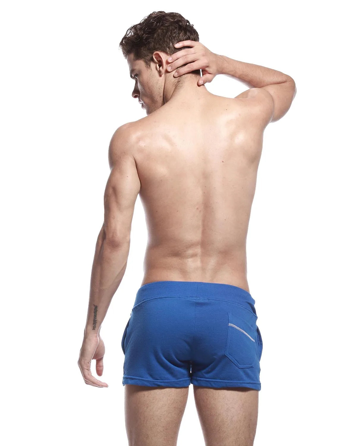 Back view of blue sport shorts showing fitted waistband and single back pocket with zip trim